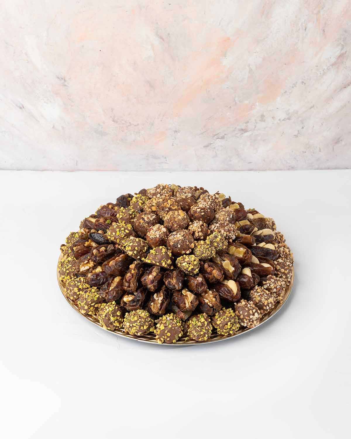 1200gms Dates Hamper by NJDChocolate & ConfectioneryYour Gift Contains:• 9 x Energy Balls with roasted Nuts• 9 x Premium Majdoul Dates with Dried mango filling• 11 x Majdoul Dates with Roasted salted Pistachio• 12 x Majdoul Dates with Roasted salted Cashe